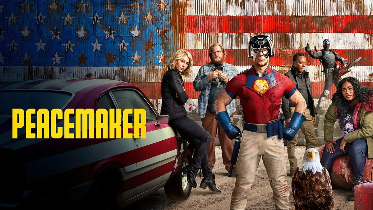 Affiche de la série Peacemaker avec les acteurs principaux devant le drapeau américain et à coté d'une voiture décorée également avec le drapeau des USA